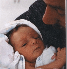 A father cradling a newborn--John and Jacob Putnam